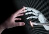 Slowdown Push – Embedded Watchdogs Inside AI Labs Human hand reaching toward a robotic hand