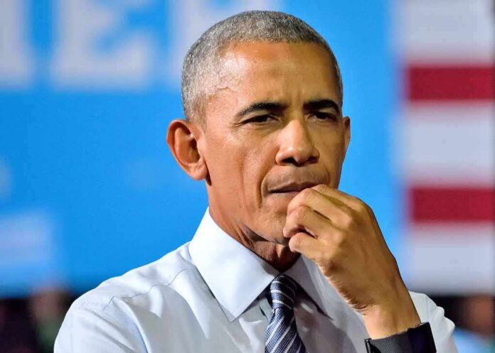 Person in a thoughtful pose with hand on chin, not Rob Nabors