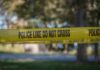 Scooter Murder Stuns NYC – Where’s The Motive? yellow police tape cordoning off an outdoor area