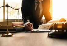 Wrong Matthew – Court Blunder Sparks Doxxing Nightmare Lawyer writing at desk with scales and gavel
