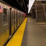Subway train at an empty underground platform