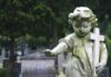 Federal Abortion Rights Push – Funding Fight Ignites Weathered statue of a child angel holding a cross in a cemetery