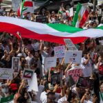 Protesters Branded ‘Terrorists’ – IRGC Opens Fire On Its Own Protest crowd with flags and signs; Seyed Ebrahim Raisi, La Parka, Brian Robiskie, Philly Brown, Miguel Francisco Barragán Andrade present