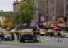 Nine Officers Targeted – One Falls Police investigate a taped-off urban street crime scene