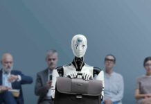 World Bank Alarm: Inequality Set To Spike Jan-Peter Nikiferow seated with a humanoid robot holding a briefcase in front