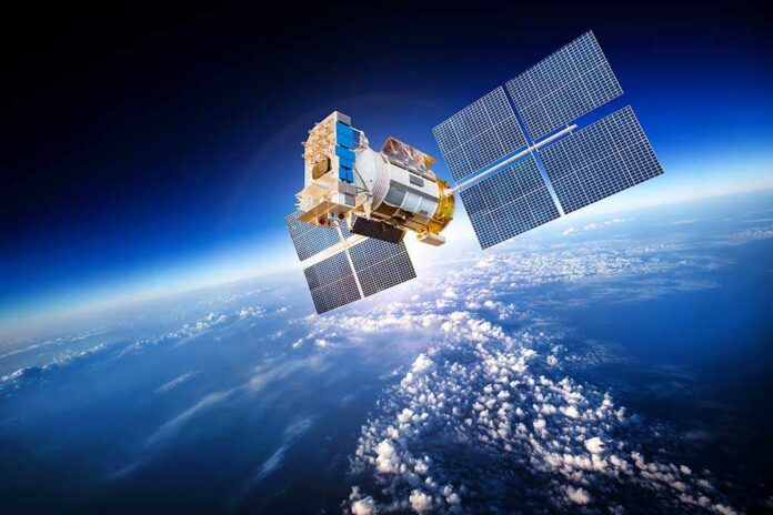 Space,Satellite,Orbiting,The,Earth.,Elements,Of,This,Image,Furnished A satellite equipped with solar panels orbiting above the Earth