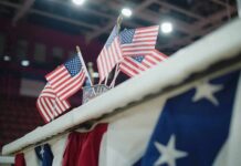 American flags on display at an indoor venue