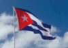 Cuban flag waving against a blue sky