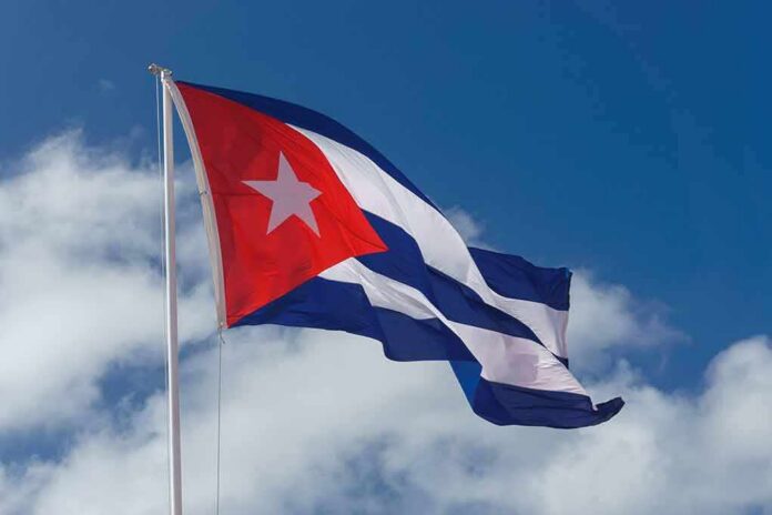 shutterstock_661566691 Cuban flag waving against a blue sky