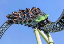 Ejected Mid-Ride – Goliath Tragedy Spurs Emergency Fix roller coaster train with riders on a curved track