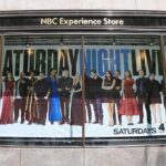 Window display with Saturday Night Live cast poster at NBC Experience Store