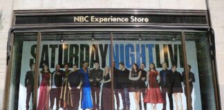 Window display with Saturday Night Live cast poster at NBC Experience Store