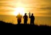 Trump Hurls Explosive Muslim Brotherhood Claim silhouettes of three armed people at sunset