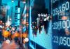 Global Gatekeeper Squeezes Indonesia – Billions At Risk digital stock market chart on city street at night